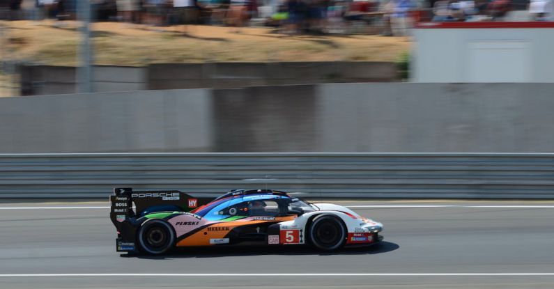 Load Speed - A racing car on the track with a crowd